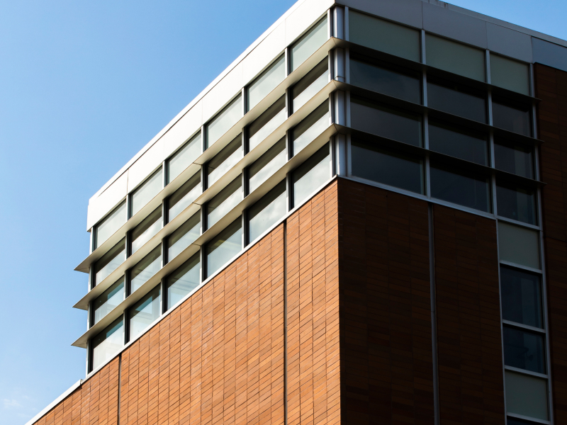 An elegant clock tower perched on a building,
highlighting its architectural beauty and the passage of
time.