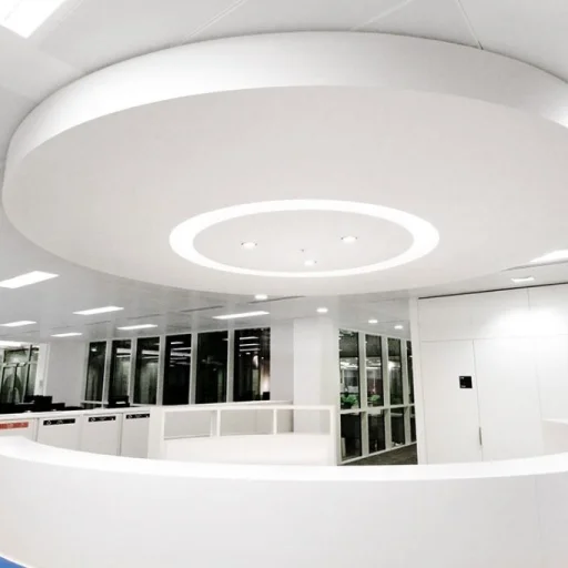 The office is a modern and open space with a sleek circular counter.